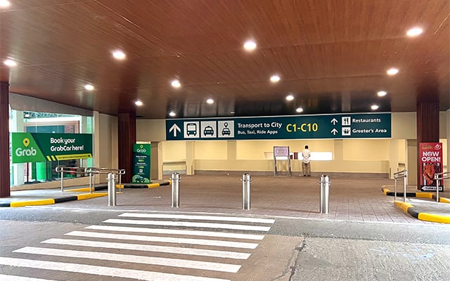 Signage at the arrivals area has been improved and the area is now brightly lit.